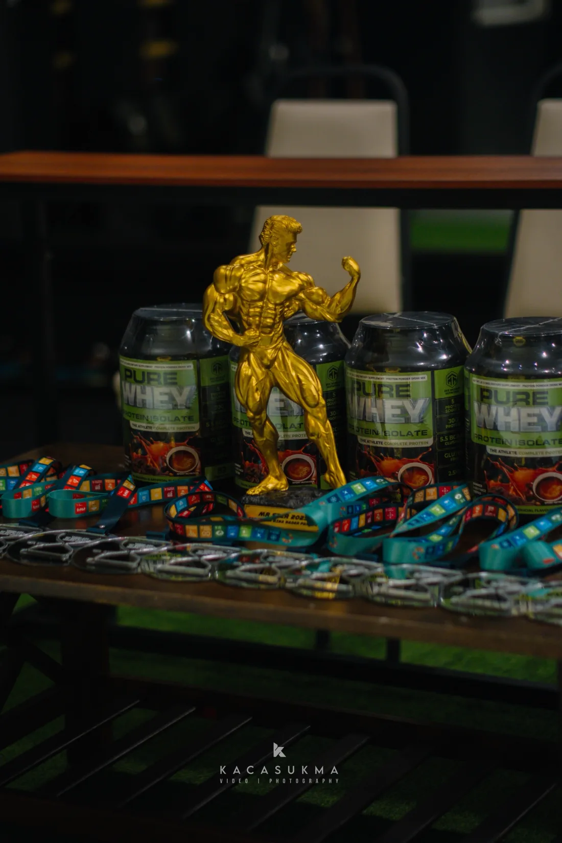 Trophy and competition medals laid out backstage